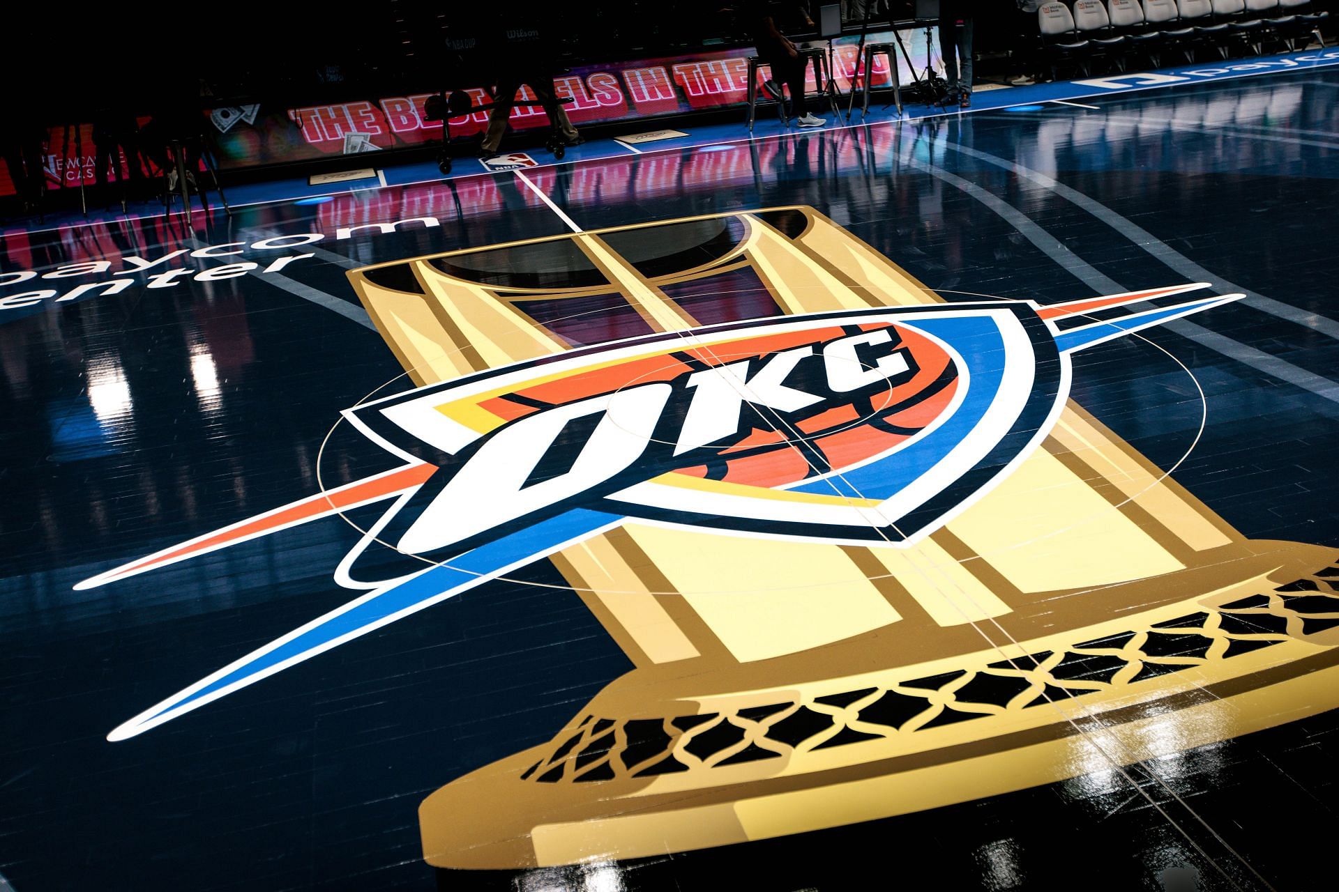 NBA Cup games showcase team logos alongside the tournament trophy. - Source: Getty